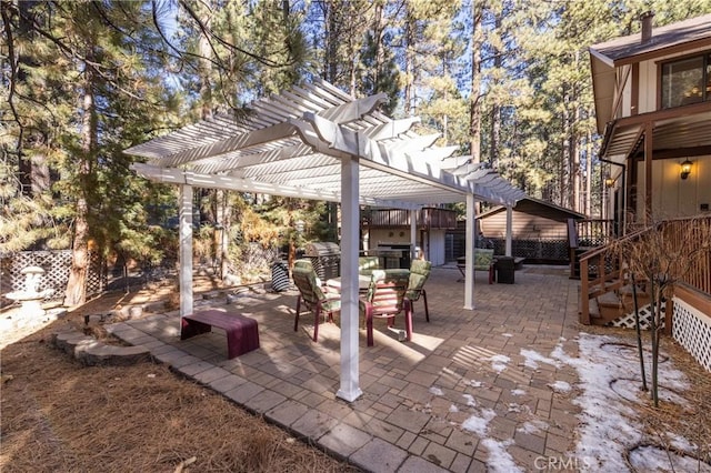 view of patio featuring a pergola