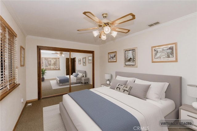 41984 Mapleleaf Dr, Big Bear Lake, CA 92315 - carpeted bedroom featuring crown molding, baseboards, ceiling fan, and a closet