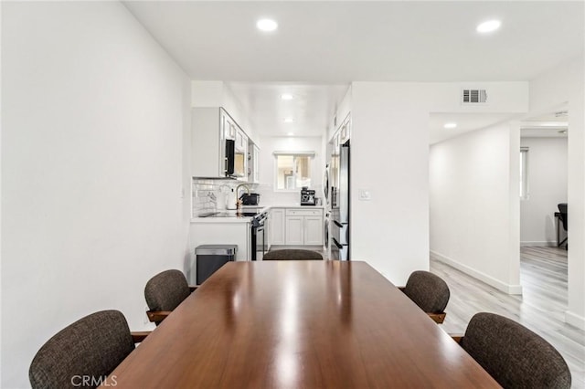 dining area featuring light hardwood / wood-style floors