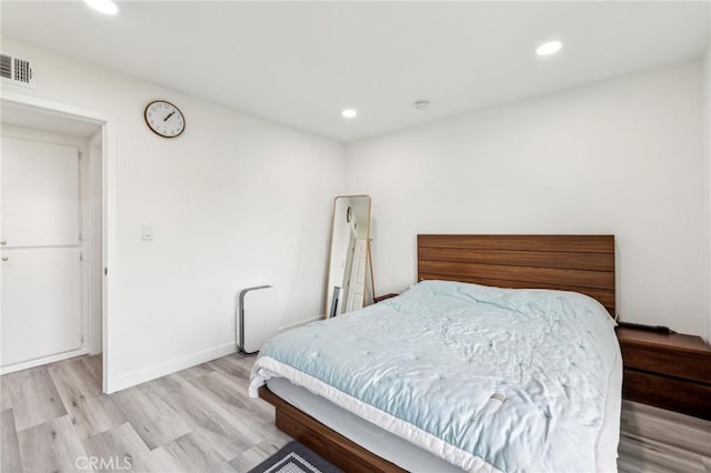 bedroom with light hardwood / wood-style flooring