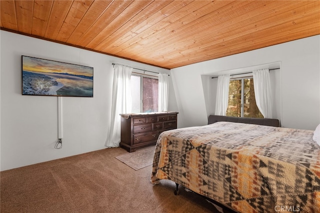 carpeted bedroom featuring wooden ceiling and crown molding