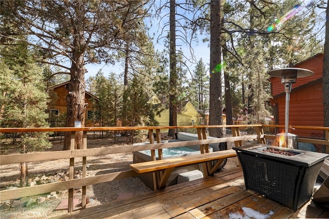 wooden deck with a fire pit