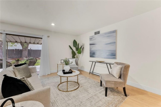 living area with light hardwood / wood-style floors