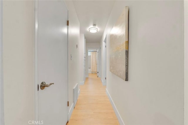 corridor featuring light hardwood / wood-style floors