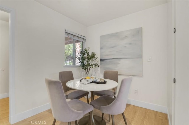 dining room with hardwood / wood-style flooring