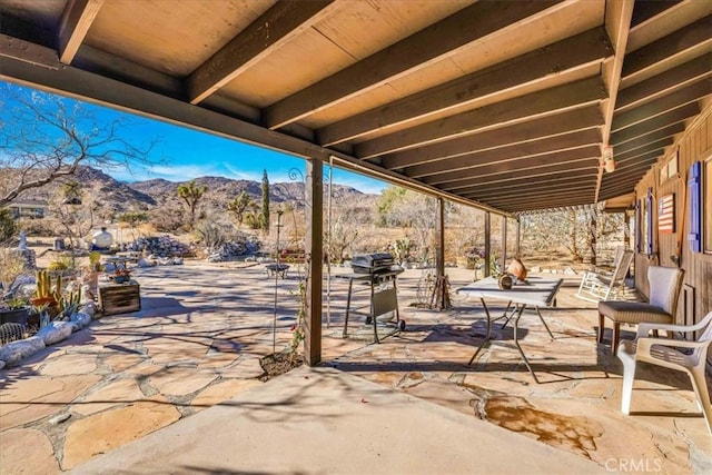 view of patio featuring a mountain view and grilling area