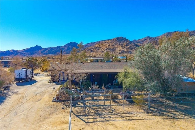 rear view of property featuring a mountain view