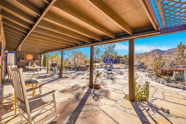 view of patio / terrace featuring a mountain view