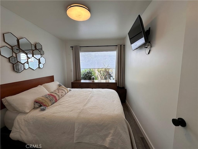 bedroom with hardwood / wood-style floors