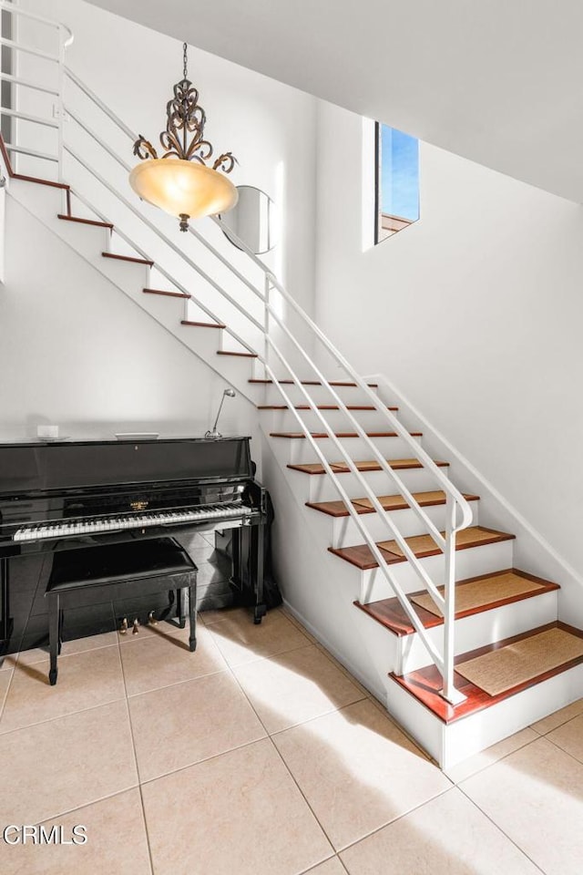 staircase with tile patterned flooring