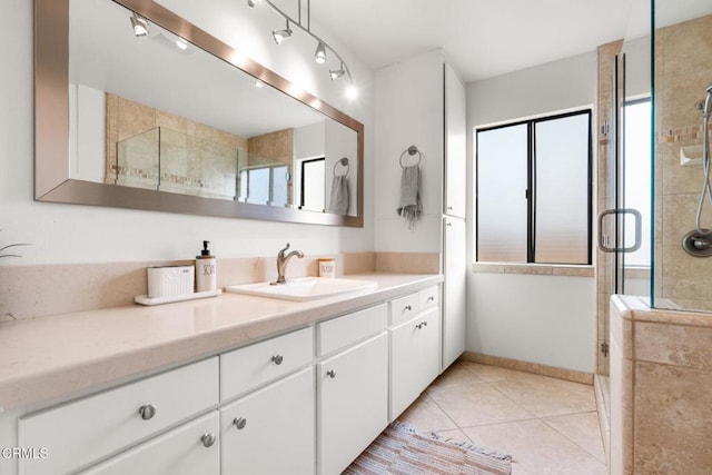 bathroom featuring vanity, an enclosed shower, and tile patterned flooring