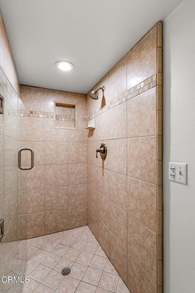 bathroom with a shower with shower door