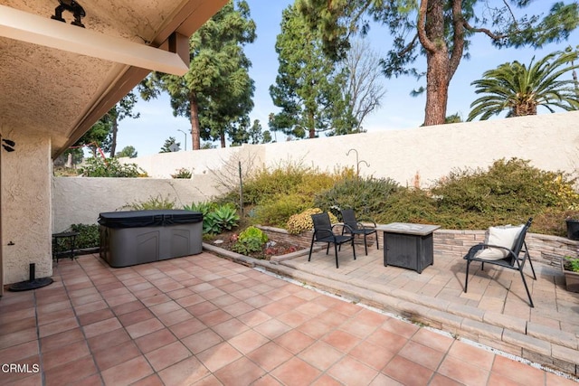 view of patio with an outdoor fire pit