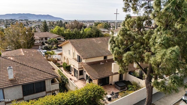 birds eye view of property featuring a mountain view