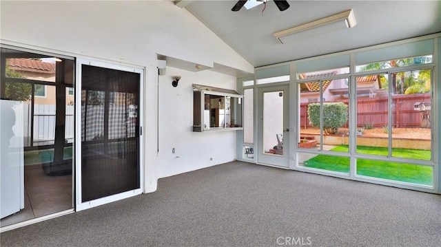 unfurnished sunroom featuring lofted ceiling and ceiling fan