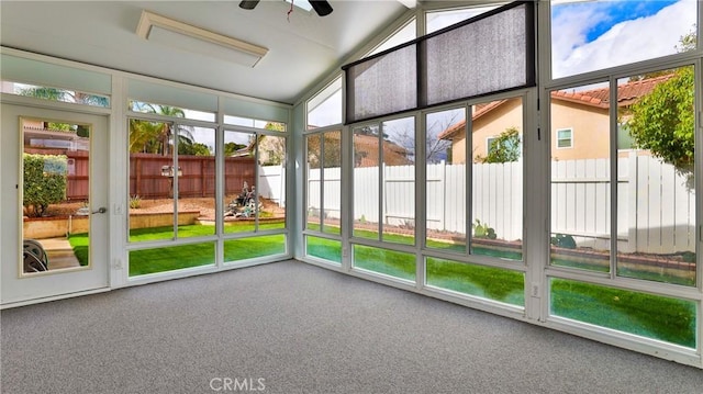 unfurnished sunroom with lofted ceiling and ceiling fan