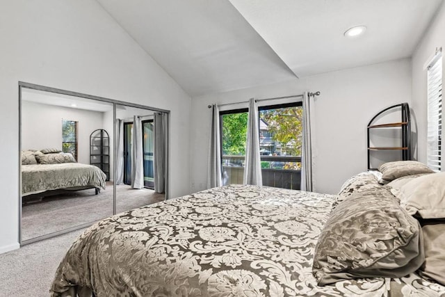 bedroom featuring lofted ceiling, carpet flooring, access to outside, and a closet