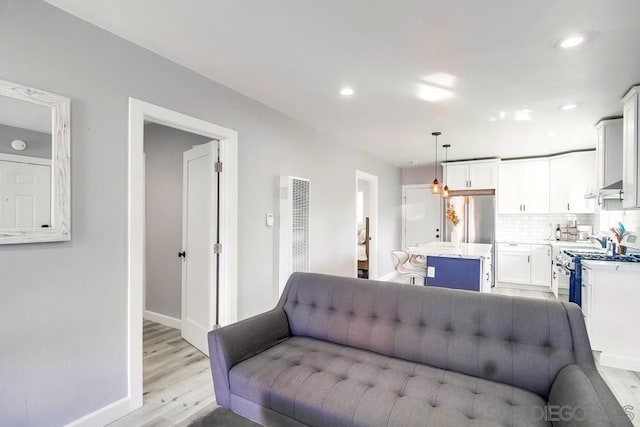 living room with light hardwood / wood-style flooring