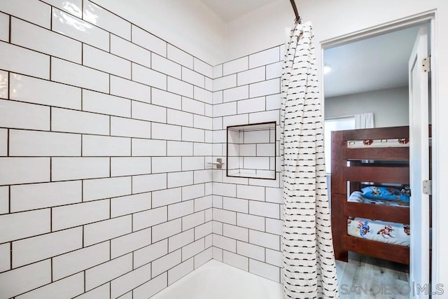 bathroom with wood-type flooring