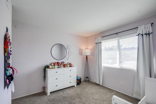 bedroom with light carpet