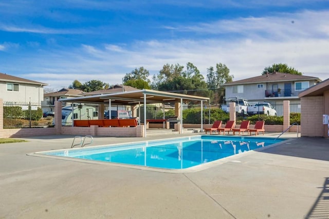 view of swimming pool with a patio