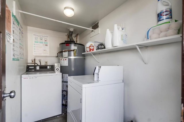 laundry area with secured water heater and washer and dryer