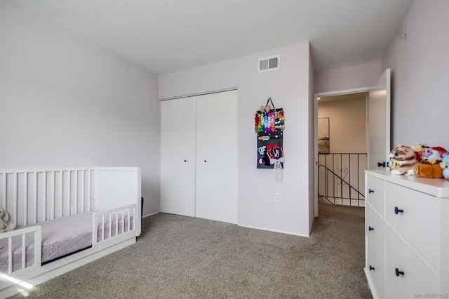 carpeted bedroom featuring a closet