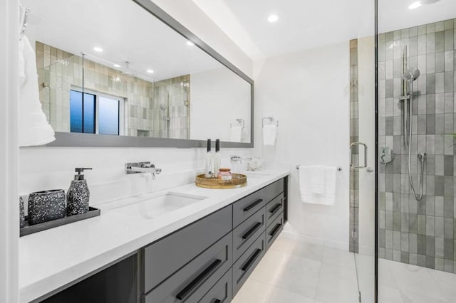 bathroom with vanity and a shower with shower door