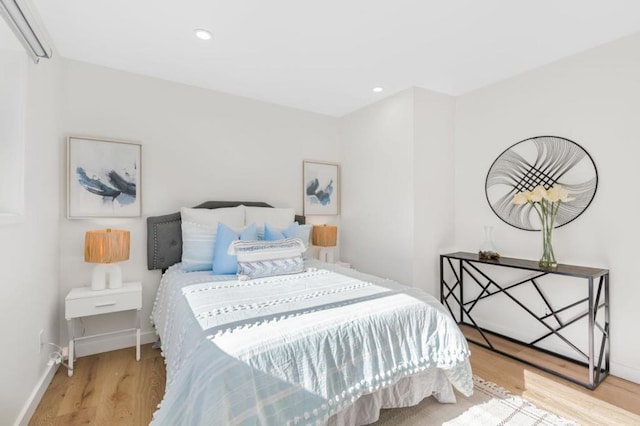 bedroom with wood-type flooring