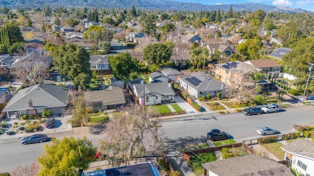 birds eye view of property featuring a mountain view