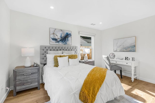 bedroom with light wood-type flooring