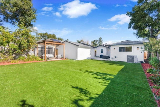 rear view of house featuring an outdoor living space, a gazebo, and a yard