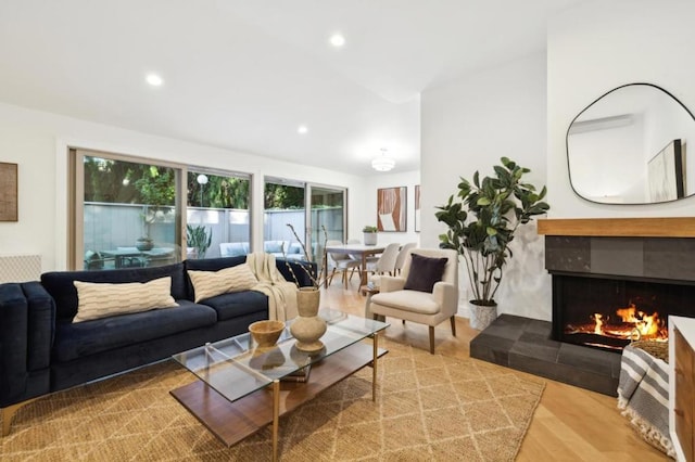 living room featuring hardwood / wood-style flooring and a fireplace