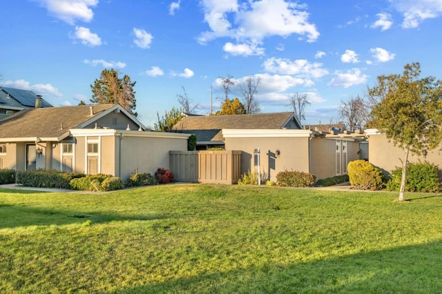 view of property exterior with a yard