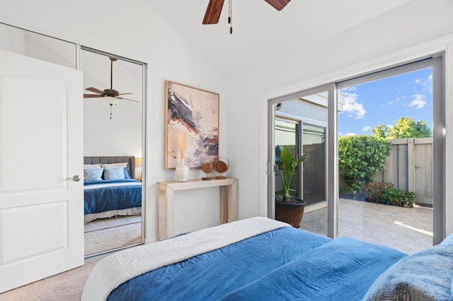 carpeted bedroom with ceiling fan, access to exterior, and vaulted ceiling