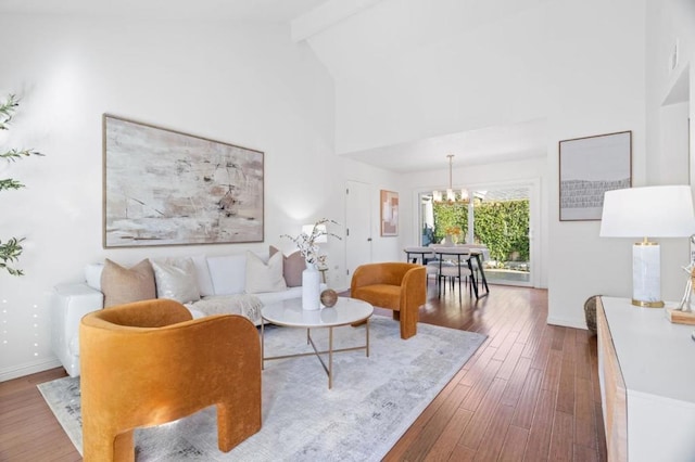 living room featuring an inviting chandelier, beamed ceiling, high vaulted ceiling, and dark hardwood / wood-style flooring