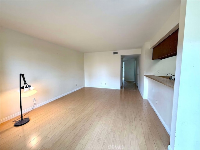 unfurnished living room featuring light hardwood / wood-style floors