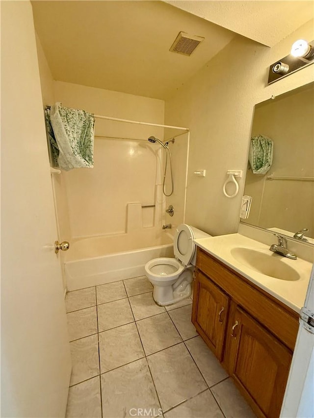 full bathroom with tile patterned floors, vanity, toilet, and shower / washtub combination