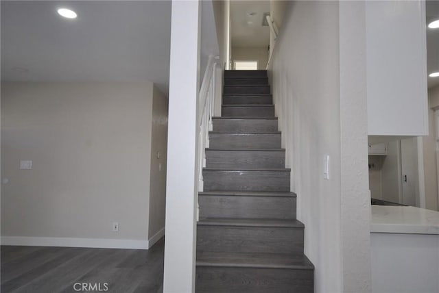 stairway with wood-type flooring