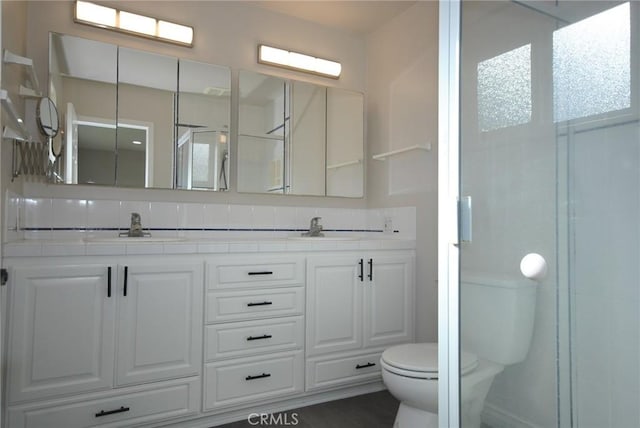 bathroom with toilet and vanity