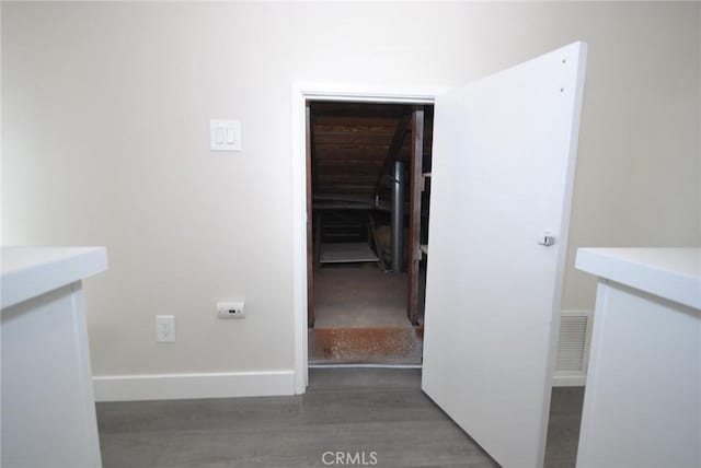 corridor with dark wood-type flooring