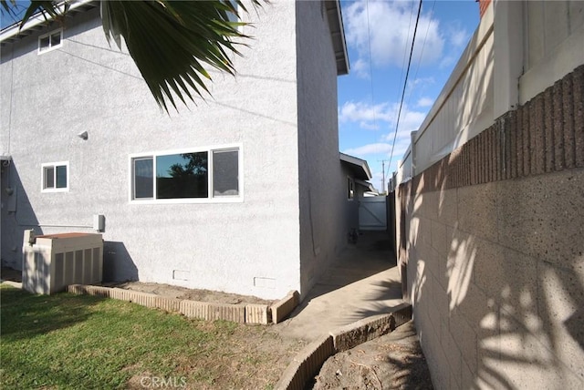 view of property exterior featuring a yard