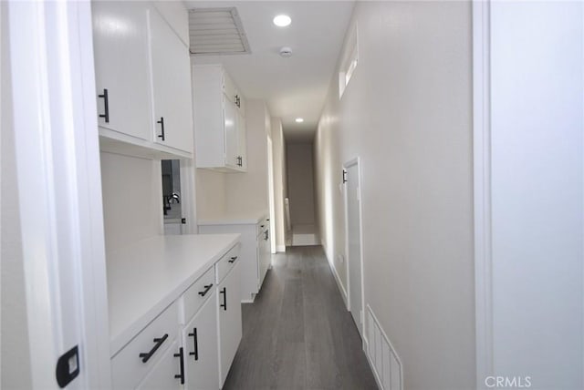 hallway featuring dark hardwood / wood-style floors