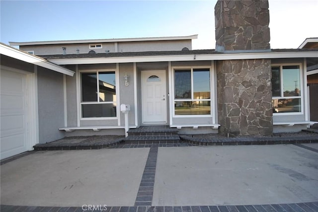 property entrance with a garage