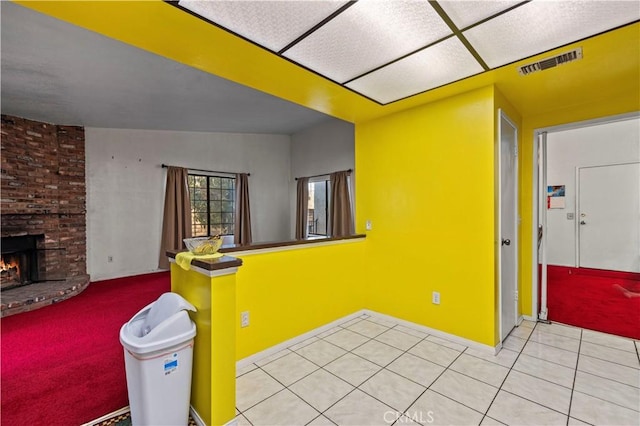 interior space featuring a fireplace and tile patterned flooring