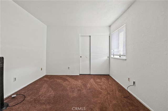 unfurnished room featuring carpet floors