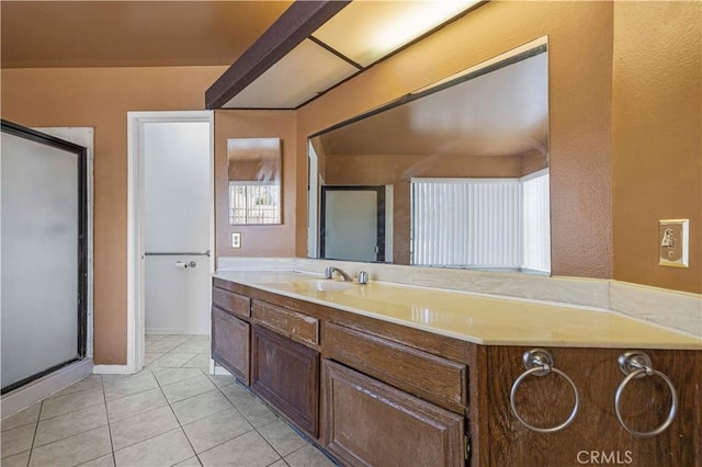 bathroom featuring walk in shower, tile patterned floors, and vanity