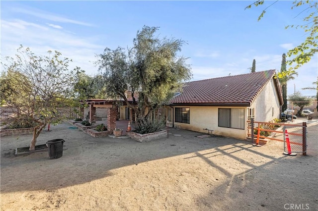 back of house with a patio