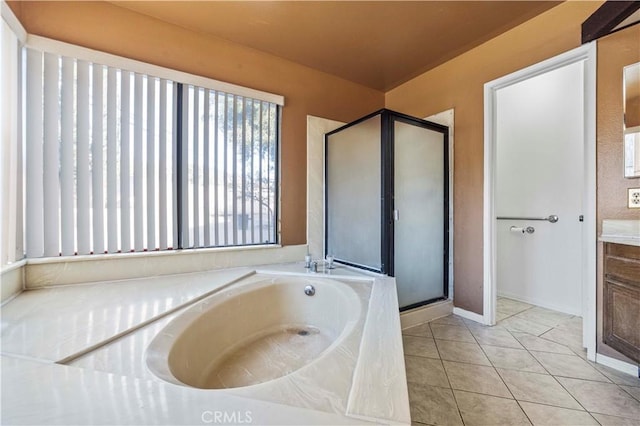 bathroom featuring separate shower and tub, tile patterned flooring, and vanity