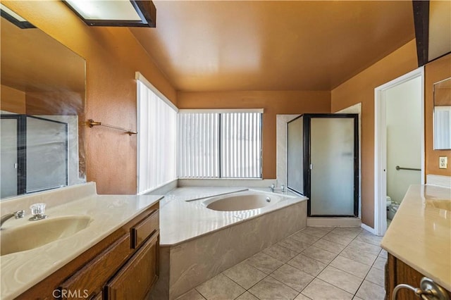 full bathroom with toilet, tile patterned floors, vanity, and independent shower and bath